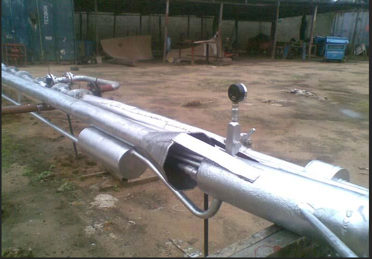 A large metal pipe with pipes
                        
                        Description automatically generated with medium confidence